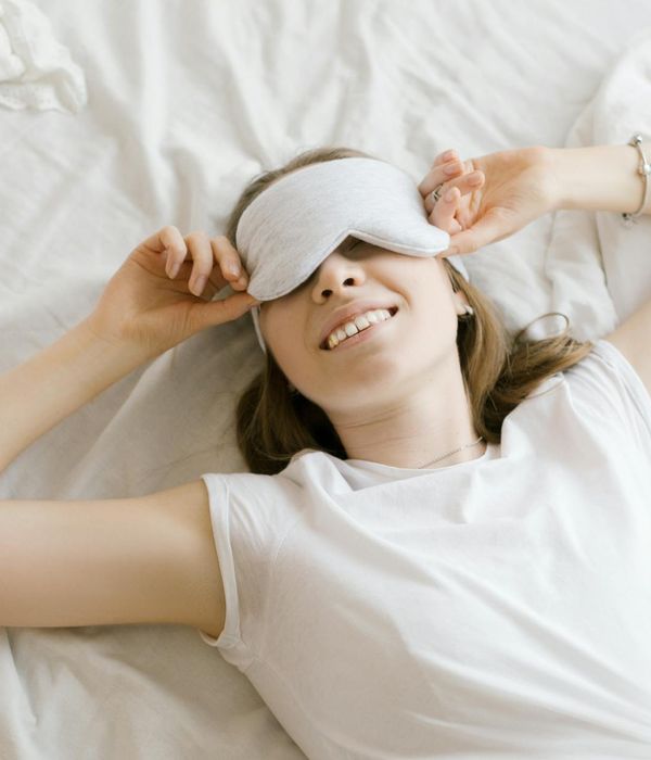 Woman feeling energetic and happy during a light workout at home.